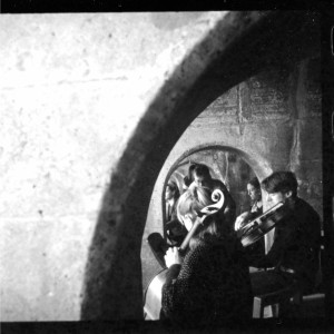 Photo showing musicians seated underneath the archways of Sunny Sands Beach, Folkestone