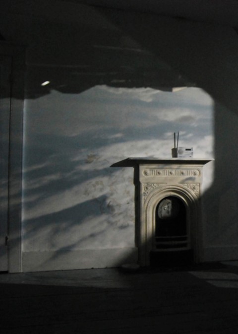 Projection of a film onto the walls of Kate's studio space showing clouds moving across the sky