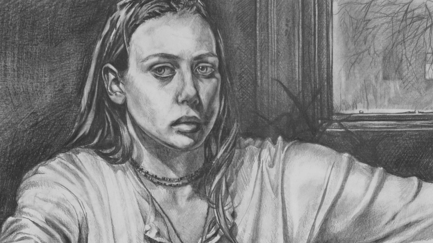 Charcoal self-portrait of Kate sitting on a low mattress