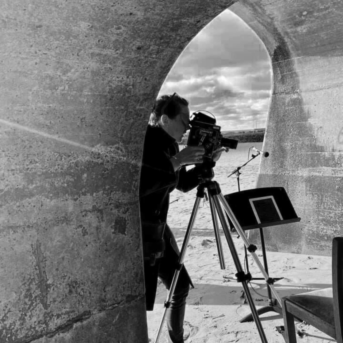 Photo of photographer taking photos under the arches of Sunny Sands Beach, Folkestone