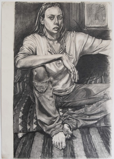 Self-portrait charcoal drawing of Kate sitting on a low mattress