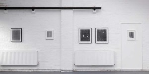 The River Garage Studio exhibition space showing wall-mounted photograms and a large tray of water on the floor