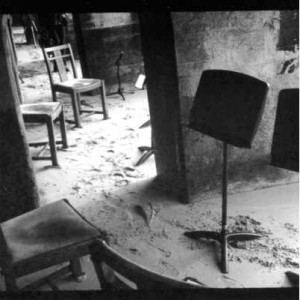 Photo of empty chairs and music stand on beach sand