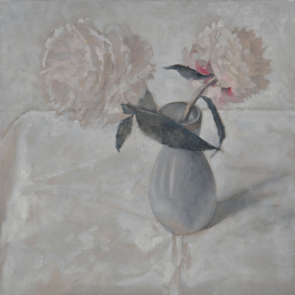 Two large, pale pink flower heads and a soft grey/blue sake jug on a white table-clothed table. The only darkness is in the elongated shapes of the peony leaves and the soft shadow of the jug.