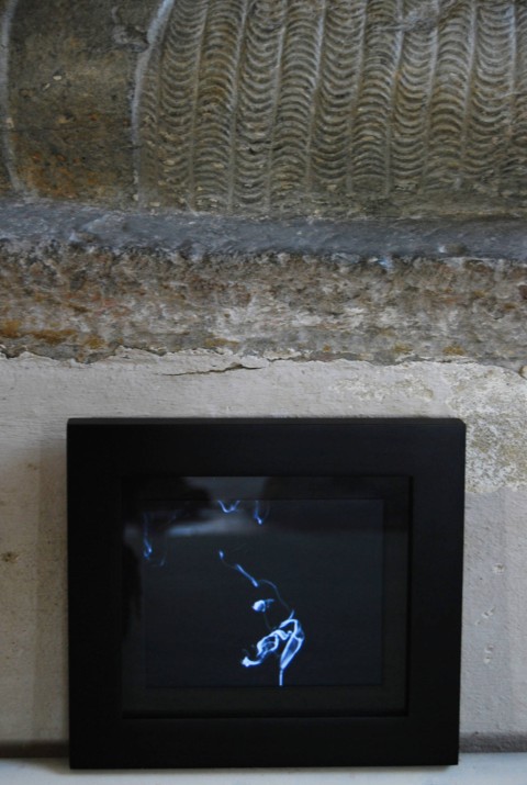 Close-up photo of the North Winter Death film playing within a black-bordered picture frame